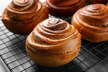 Sweet cinnamon rolls on cooling rack