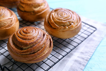 Sweet cinnamon rolls on cooling rack