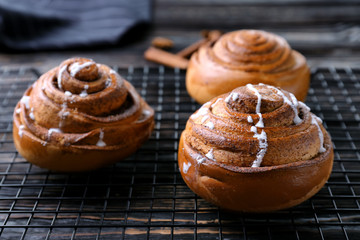 Sweet cinnamon rolls on cooling rack