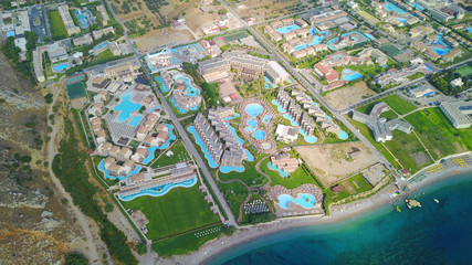 August 2017: Aerial drone photo of famous pools and 5 star resorts - hotels at small village of Kolympia bay, Rhodes island, Aegean, Dodecanese, Greece