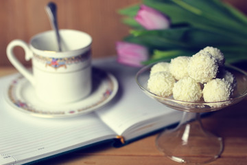 flower on the book and tea