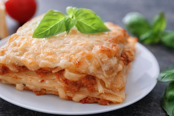 Plate with tasty lasagna, close up