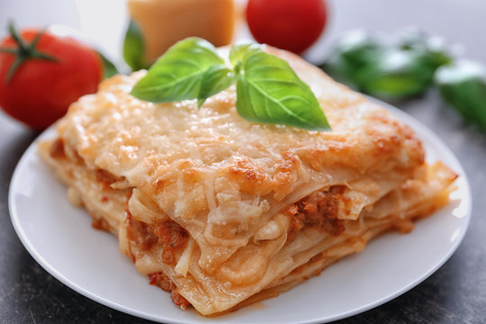 Plate with tasty lasagna, close up