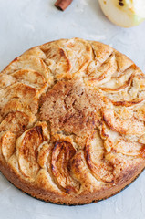 Easy apple tea cake on a linen napkin. White background and close up.