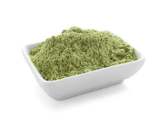 Bowl of barley powder on white background