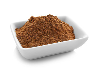 Bowl of cumin spice on white background