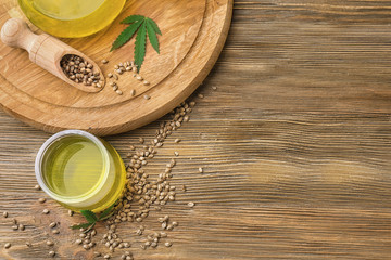 Composition with hemp oil in jar on table