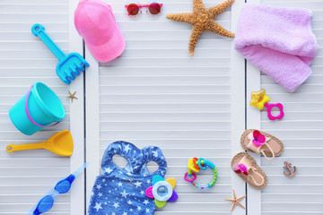 Obraz na płótnie Canvas Set of baby beach accessories on light background