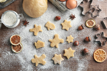 Process of making Christmas cookies on wooden background