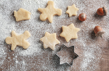 Process of making Christmas cookies on wooden background