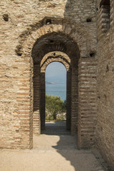 Fototapeta na wymiar Old Gate Sirmeone Italy