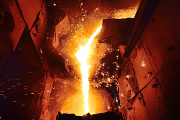 Cast iron and metal at the metallurgical plant. Molten metal in the furnace