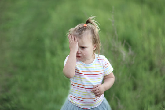 Toddler Girl Is Crying And Rubbing His Eyes