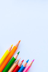 Set of colorful pencils on a white background. Close up and copy space.