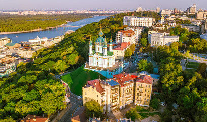 Aerial top view of Saint Andrew's church and Andreevska street from above, cityscape of Podol...
