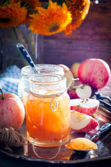 Apple jam with slices of apples in a glass jar, selective focus
