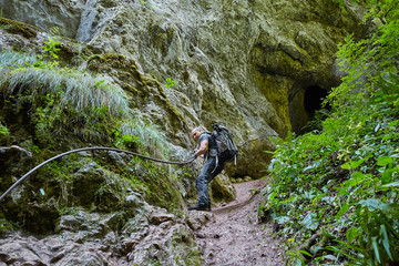 Man climbing on safety chains
