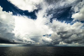Dark clouds in open ocean