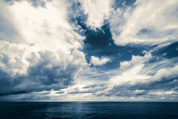 Naklejka na ściany i meble Dark clouds in open ocean