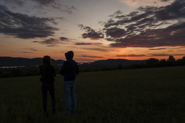 loving young pair watching sunset