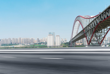 empty asphalt road with cityscape of modern city