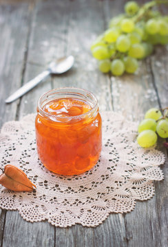 Slatko - Preserved White Grapes In Glass Jar, On Wooden Background; Traditional Serbian Desert Of White Grapes Or White Cherries