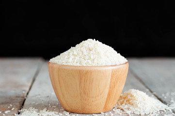 Rice on wooden table.