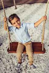 Little boy on swing