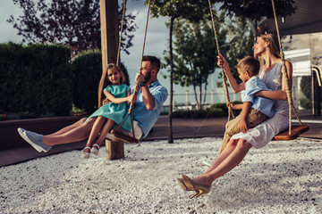 Family on swing