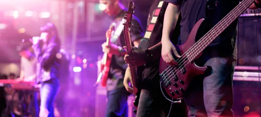 Draagtas Guitarists on stage for background, soft focus and blur concept © ipopba