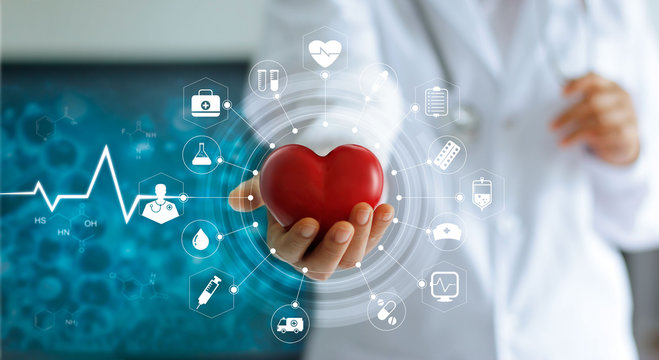 Medicine Doctor Holding Red Heart Shape In Hand And Icon Medical Network Connection With Modern Virtual Screen Interface In Laboratory, Medical Technology Network Concept