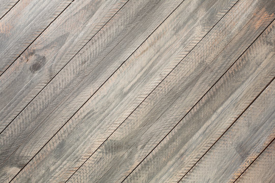 Gray rustic wooden background. Diagonal borders orientation