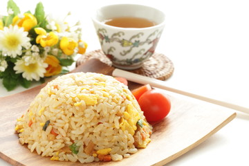 Chinese fried rice on wooden plate