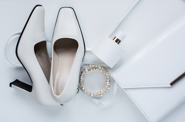 white female accessories. Handbag with perfume and shoes
