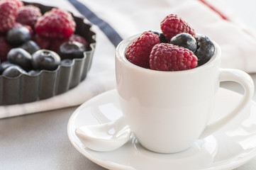 Healthy mixed fruit and ingredients with strawberry, raspberry, blueberry, blackberry from top view