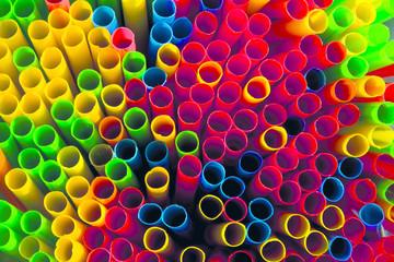 photo colored plastic beverage cans stand tightly on the storefront for sale