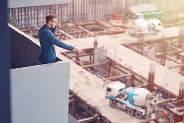 Fototapeta premium Professional senior construction engineer giving instructions