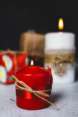 Christmas background with decorations and gift boxes on wooden board.
