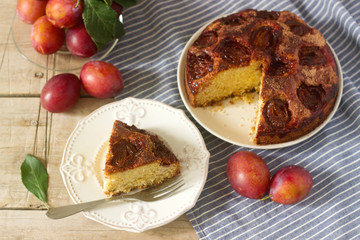 Plum pie or cake with cinnamon and sugar. Selective focus.