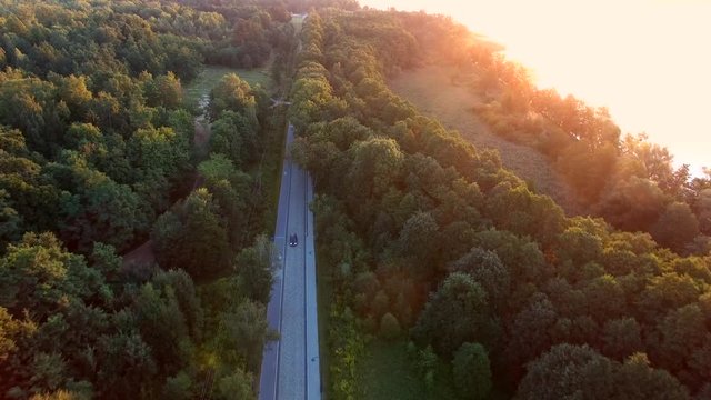 Aerial of Countryside Road and Car at Sunrise