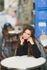 Beautiful young woman posing on the street in old city