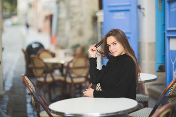 Portrait of a young beautiful woman in a urban background
