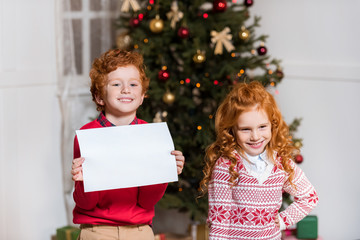 happy kids with blank paper