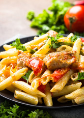 Pasta penne with meat and vegetables.