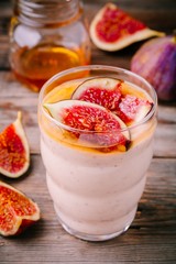 healthy breakfast smoothie with fresh figs and honey in glasses