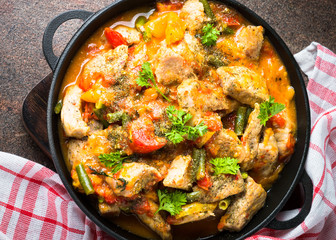 Stewed pork with vegetables in tomato sauce.