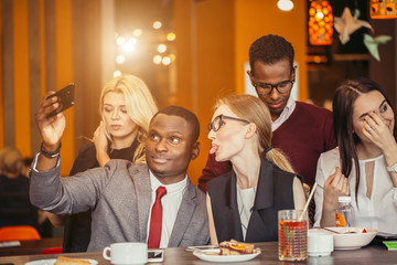 People taking selfie at business meeting