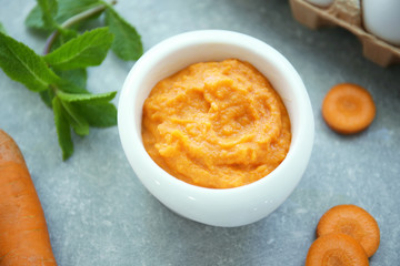 Ramekin with tasty carrot souffle on table