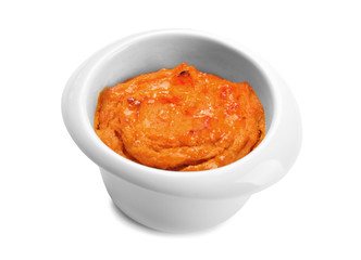 Ramekin with tasty carrot souffle on white background
