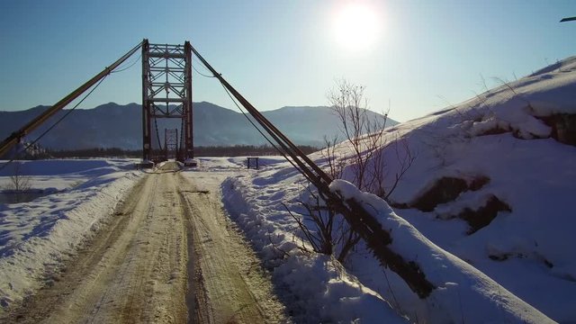 Video of movement on the suspension bridge over Altai river Katun in winter season